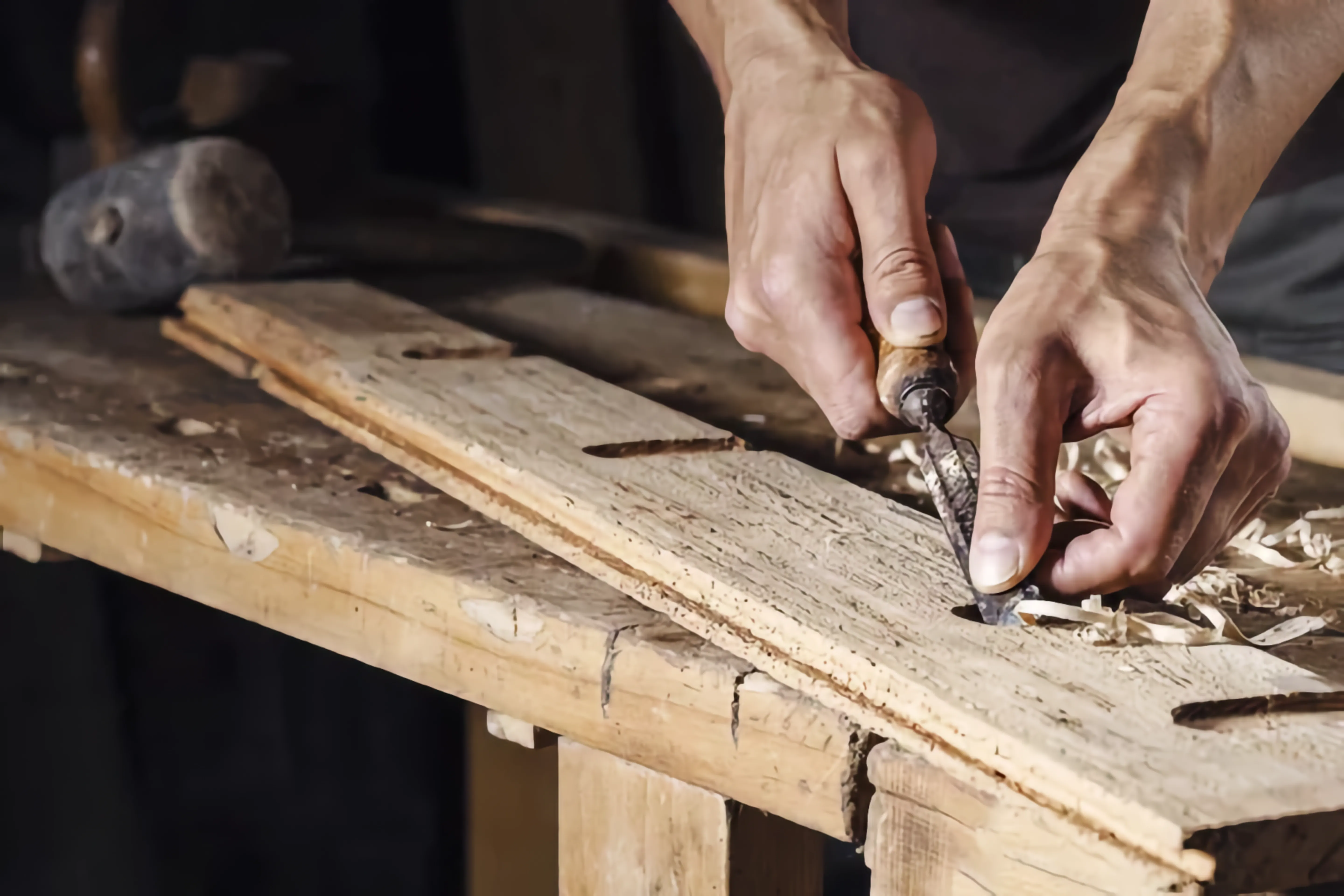 Hands working in a craft workshop symbolizing careful, hands-on work